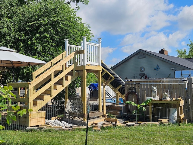 exterior space featuring a yard, fence, and a gazebo