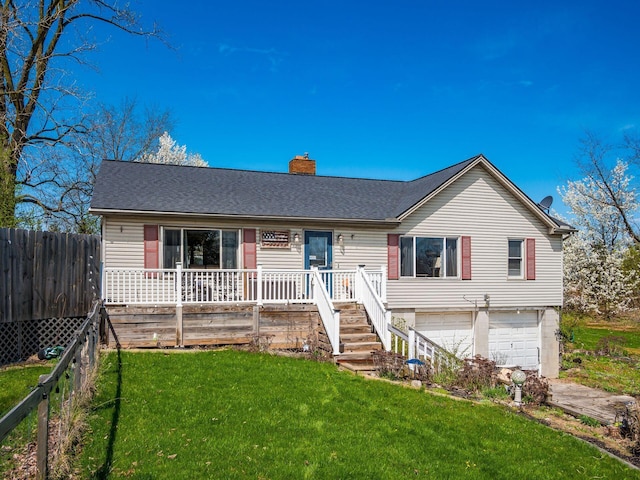 single story home with a garage, fence, a chimney, a front lawn, and a shingled roof