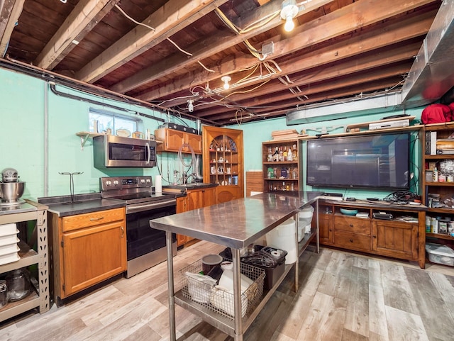 interior space featuring appliances with stainless steel finishes and light wood-style floors