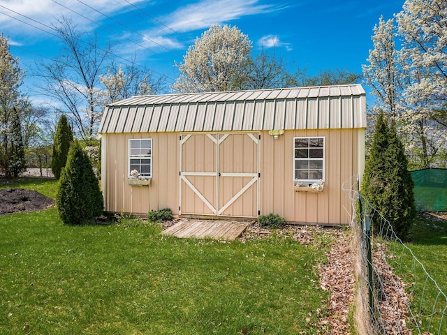 view of shed featuring fence