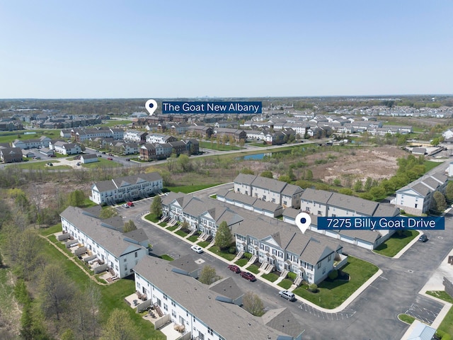 birds eye view of property with a residential view