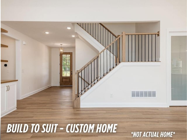1736 Harvey Ln, Grove City, OH 43123 - staircase featuring recessed lighting, wood finished floors, visible vents, and baseboards