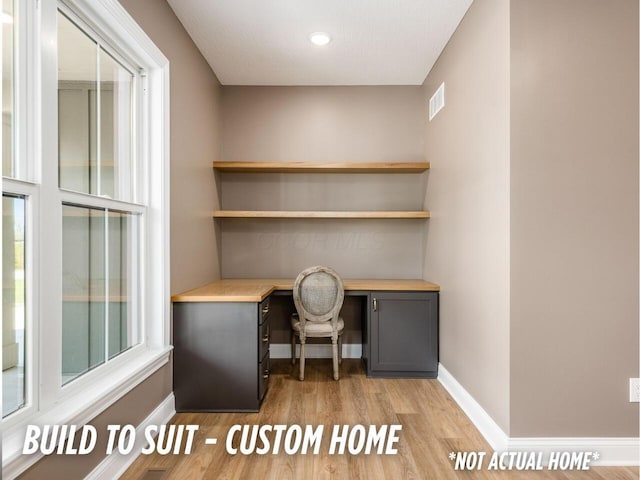 1736 Harvey Ln, Grove City, OH 43123 - unfurnished office with built in study area, light wood-style floors, and baseboards