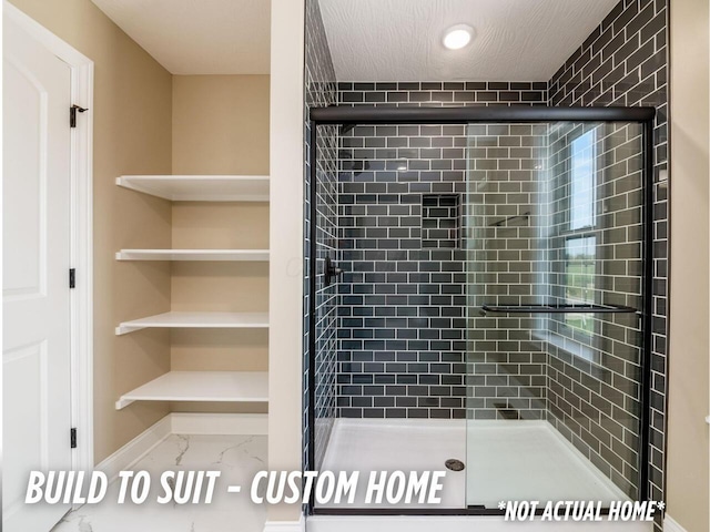 1736 Harvey Ln, Grove City, OH 43123 - bathroom with baseboards, marble finish floor, and a shower stall