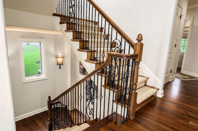 10577 Wellington Blvd, Powell, OH 43065 - staircase featuring wood finished floors and baseboards