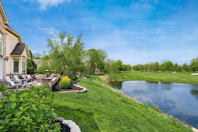 10577 Wellington Blvd, Powell, OH 43065 - view of grassy yard with a patio area, a water view, and view of wooded area