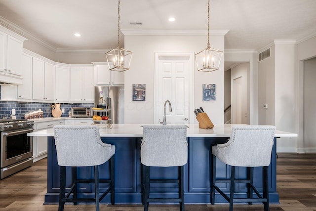 8688 Eliot Dr, Plain City, OH 43064 - kitchen featuring a notable chandelier, visible vents, ornamental molding, and appliances with stainless steel finishes