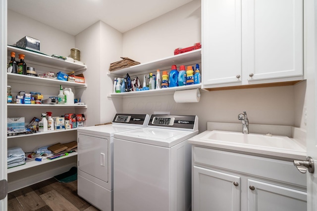8688 Eliot Dr, Plain City, OH 43064 - laundry area featuring independent washer and dryer, wood finished floors, a sink, and cabinet space