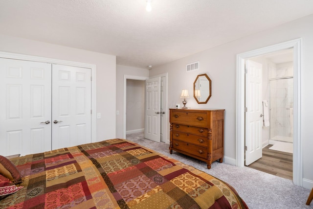 8688 Eliot Dr, Plain City, OH 43064 - bedroom featuring light carpet, visible vents, baseboards, and a closet