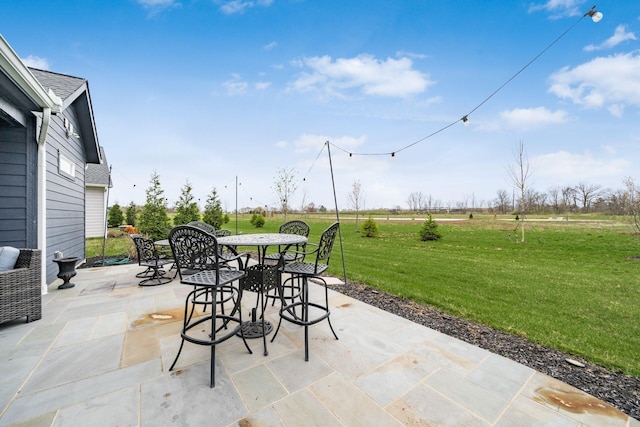 8688 Eliot Dr, Plain City, OH 43064 - view of patio featuring a rural view and outdoor dining space