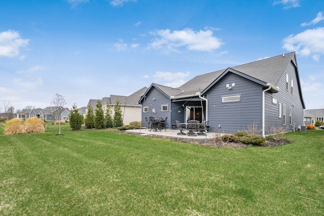 8688 Eliot Dr, Plain City, OH 43064 - back of property with cooling unit, a patio, and a lawn