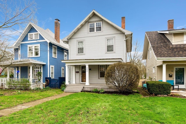 300 N Franklin St, Delaware, OH 43015 - view of front facade with a front lawn and covered porch