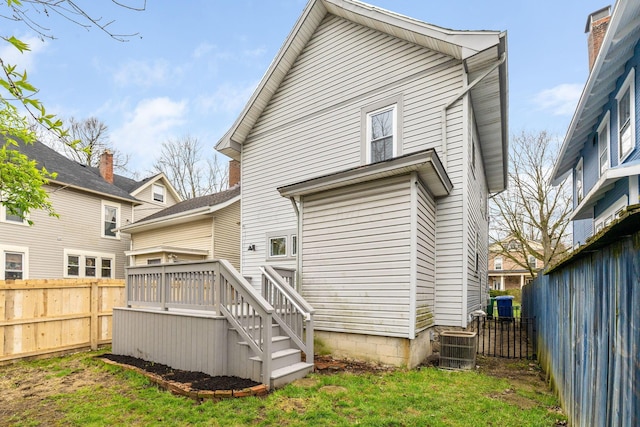 300 N Franklin St, Delaware, OH 43015 - rear view of property with a wooden deck, fence, and central AC