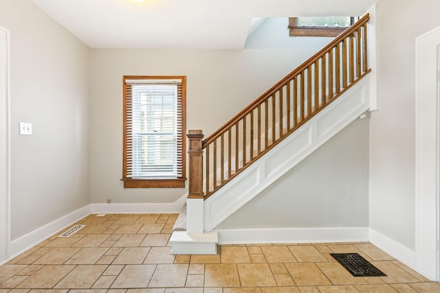 300 N Franklin St, Delaware, OH 43015 - foyer entrance featuring stairway, visible vents, and baseboards