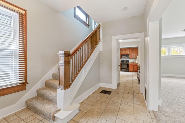 300 N Franklin St, Delaware, OH 43015 - staircase with visible vents and baseboards