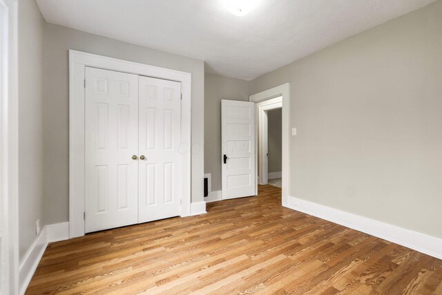 300 N Franklin St, Delaware, OH 43015 - unfurnished bedroom with visible vents, a closet, light wood-style flooring, and baseboards