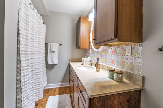 300 N Franklin St, Delaware, OH 43015 - bathroom featuring wood finished floors, vanity, and baseboards