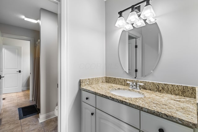 3697 Echo Pl, Powell, OH 43065 - bathroom with toilet, tile patterned floors, vanity, and baseboards