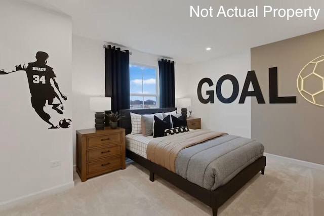 bedroom featuring light carpet and baseboards