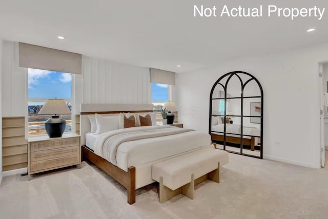 bedroom featuring recessed lighting and light carpet