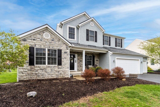 traditional home with a porch, driveway, stone siding, and stucco siding