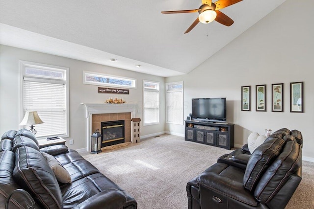 living room featuring baseboards, a tiled fireplace, a ceiling fan, carpet floors, and high vaulted ceiling