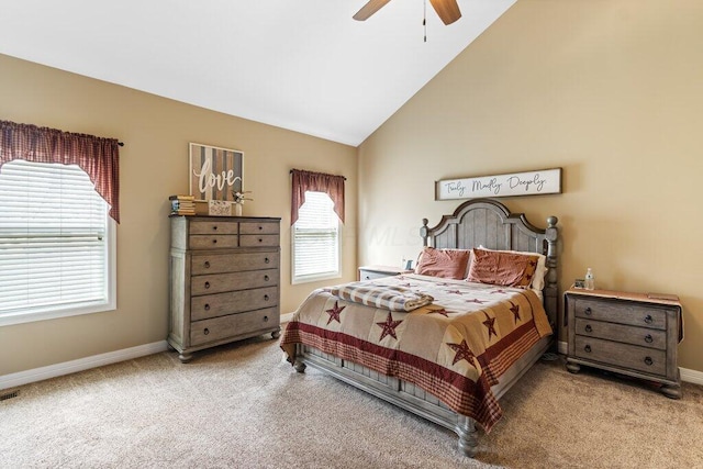 carpeted bedroom with baseboards, vaulted ceiling, and a ceiling fan
