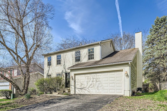 3225 Bellerive Dr, Pickerington, OH 43147 - view of front of home featuring fence, driveway, central AC, and a chimney