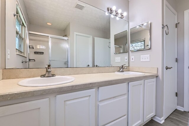 3225 Bellerive Dr, Pickerington, OH 43147 - full bathroom with a sink, double vanity, and a stall shower