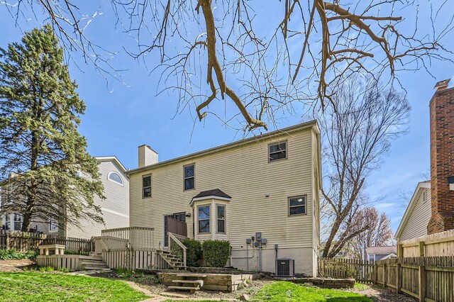 3225 Bellerive Dr, Pickerington, OH 43147 - rear view of property with central AC unit, a chimney, fence, and a deck