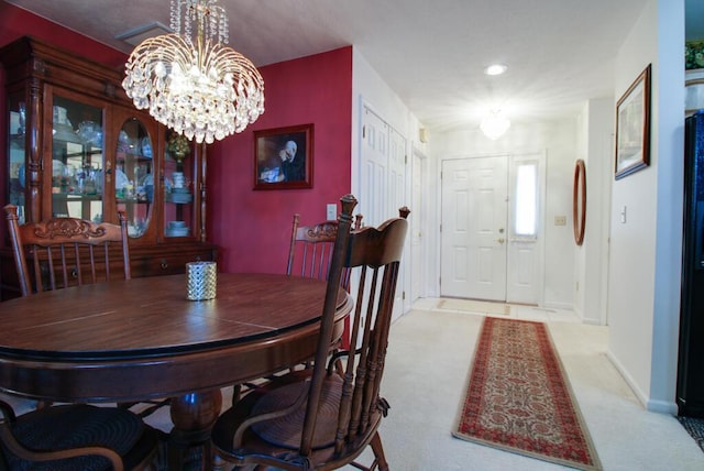 2266 Feather Ln, Marion, OH 43302 - carpeted dining space featuring baseboards and an inviting chandelier