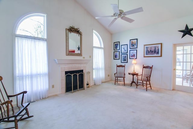 2266 Feather Ln, Marion, OH 43302 - living area featuring high vaulted ceiling, a tiled fireplace, carpet flooring, and a ceiling fan