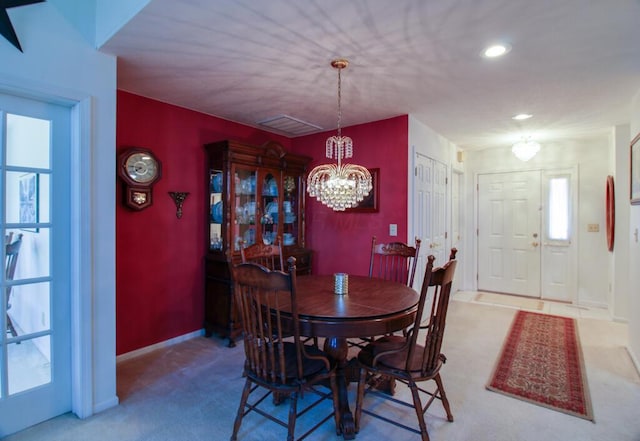 2266 Feather Ln, Marion, OH 43302 - dining space featuring carpet floors, plenty of natural light, and an inviting chandelier