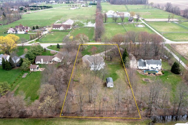 birds eye view of property featuring a rural view