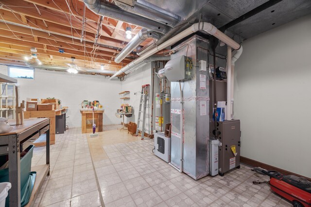 below grade area with tile patterned floors and gas water heater