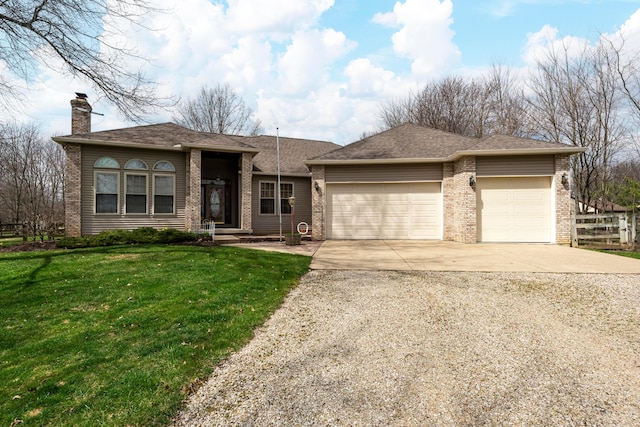 view of front of house with concrete driveway, a garage, a front lawn, and brick siding