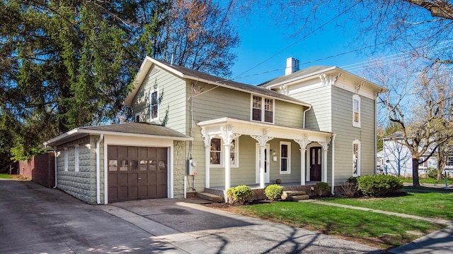 134 N Pearl St, Granville, OH 43023 - italianate house with covered porch, a front yard, driveway, and an attached garage