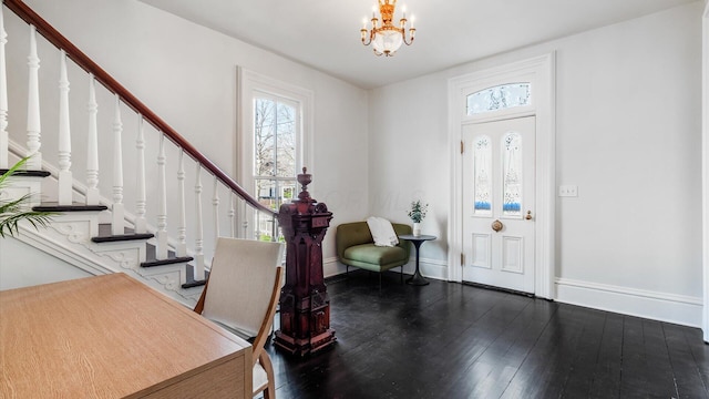 134 N Pearl St, Granville, OH 43023 - foyer with stairs, hardwood / wood-style floors, a chandelier, and a healthy amount of sunlight