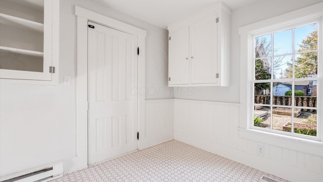 134 N Pearl St, Granville, OH 43023 - unfurnished room featuring a wainscoted wall and a baseboard heating unit