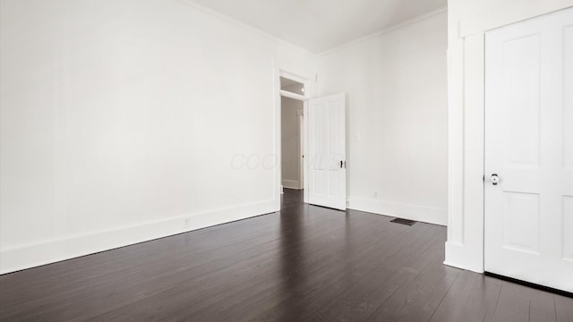 134 N Pearl St, Granville, OH 43023 - spare room with dark wood-type flooring, ornamental molding, and baseboards