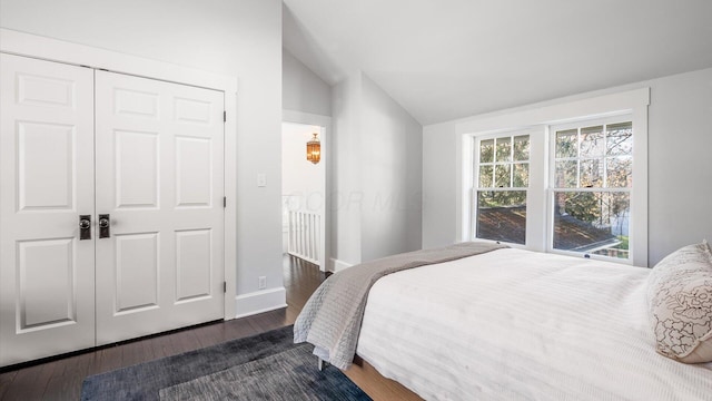 134 N Pearl St, Granville, OH 43023 - bedroom featuring a closet, baseboards, vaulted ceiling, and dark wood finished floors