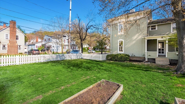 134 N Pearl St, Granville, OH 43023 - view of yard featuring fence, a vegetable garden, entry steps, and a residential view