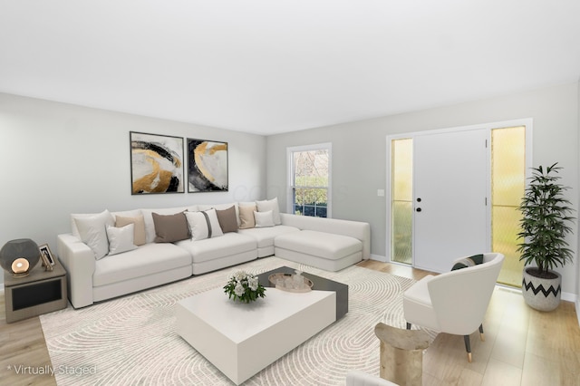 living room featuring light wood-style flooring and baseboards