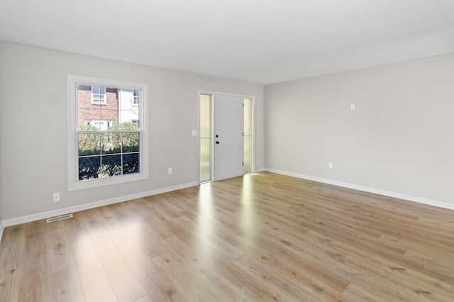 interior space with visible vents, baseboards, and light wood-type flooring