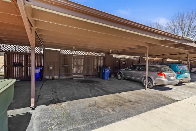 covered parking lot with fence