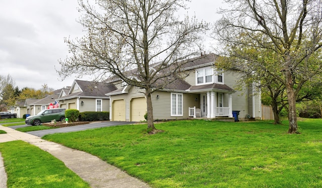 view of front of home featuring a residential view, driveway, and a front lawn