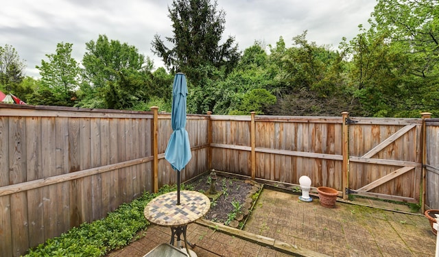 fenced backyard with a patio