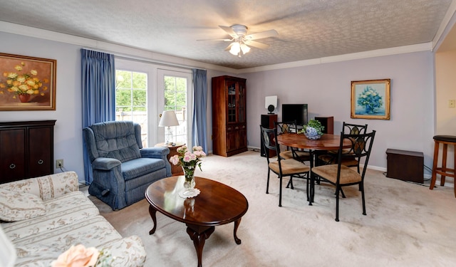 living room with light colored carpet, ceiling fan, and a textured ceiling