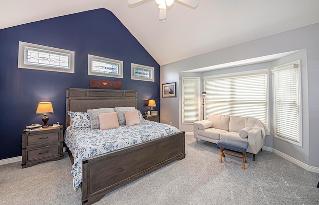 carpeted bedroom featuring multiple windows, baseboards, a ceiling fan, and lofted ceiling