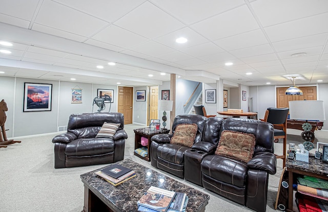 living room with baseboards, recessed lighting, stairway, carpet, and a drop ceiling